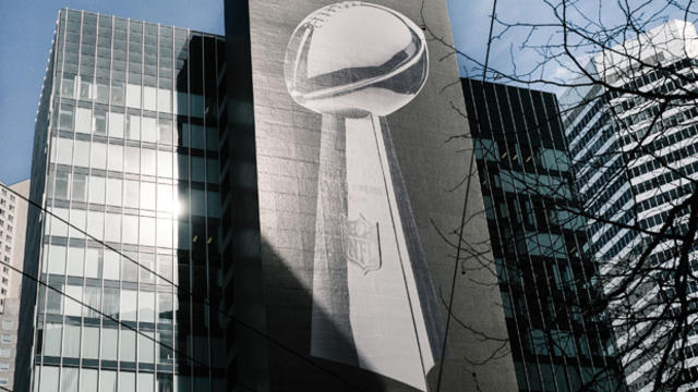 A large graphic of the Vince Lombardi Trophy promoting Super Bowl 50 is displayed on a skyscraper on Feb. 3, 2016, in San Francisco, California. 