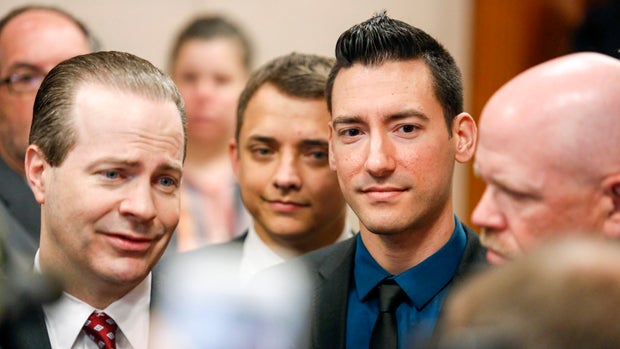 Attorney Jared Woodfill, left, speaks to the media alongside client David Daleiden, center, a defendant in an indictment stemming from a Planned Parenthood video he helped produce, and attorney Terry Yates, right, at the Harris County Courthouse after Dal 