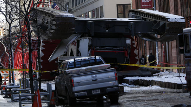 A construction crane lies on a street in downtown Manhattan in New York on Feb. 5, 2016. 