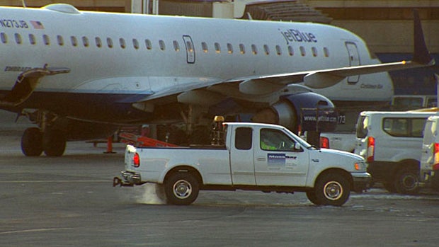 ​JetBlue Flight 891 sits parked at a gate at Logan Airport after it was struck by a van Feb. 12, 2016, in Boston. 