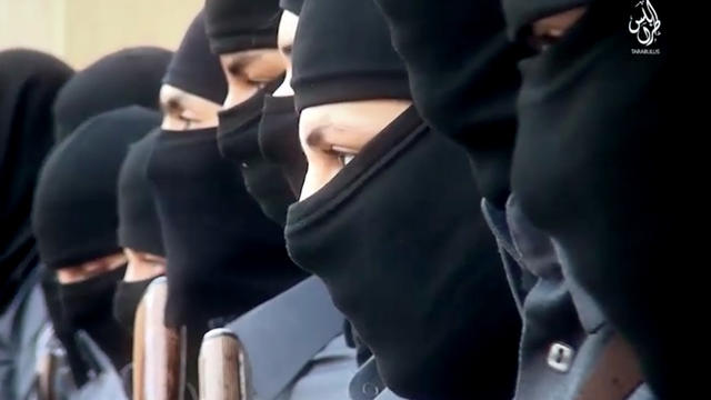 This image made from video posted online Dec. 20, 2015, by supporters of the Tripoli Province of the Islamic State of Iraq and Syria in Libya on a social media site shows training of its "Islamic police" in Sirte, Libya. 