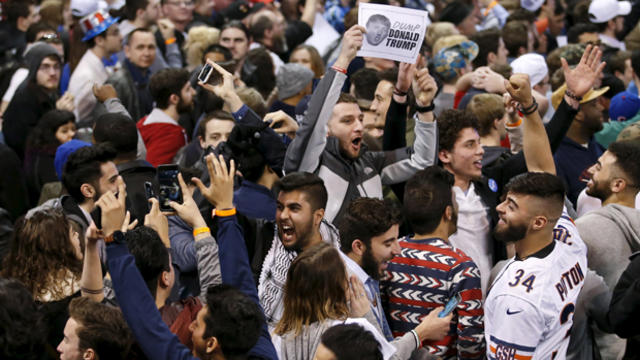 ​Demonstrators cheer after Republican presidential candidate Donald Trump canceled his rally at the University of Illinois at Chicago March 11, 2016. 