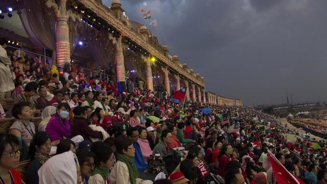 ​Attendees sit on a massive structure constructed on the banks of the Yamuna River in New Delhi, India, for the three-day festival organized by guru Sri Sri Ravishankar's Art of Living foundation 