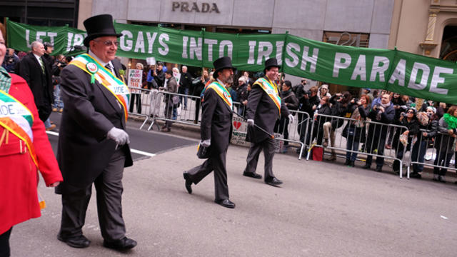 Marchers pass a group of protesters during the St. Patrick's Day Parade in New York on March 17, 2015. 