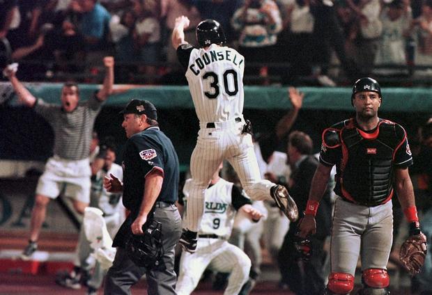 Florida Marlins player Craig Counsell jumps in the 