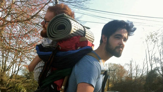 A friend carries Kevan Chandler on his back. 