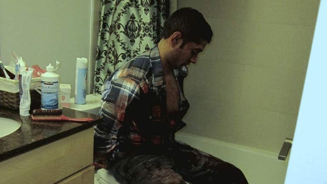 A bloody Rahul Gupta at the crime scene 