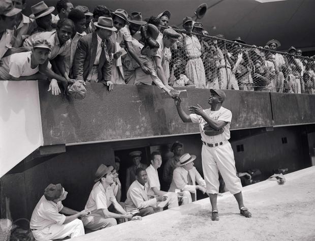 Jackie Robinson Signing Autographs from Field 