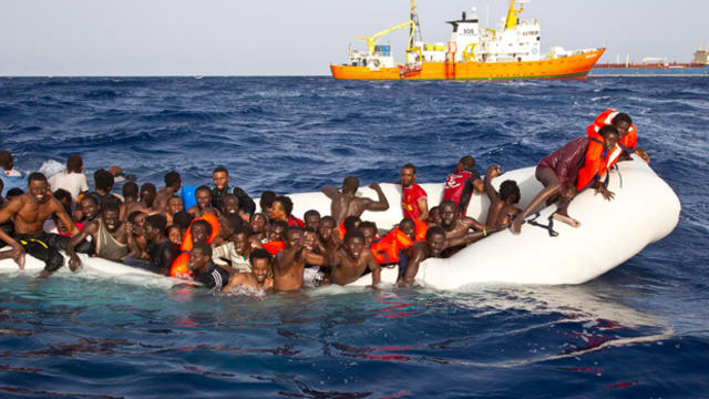 ​Migrants sit in a rubber dinghy during a rescue operation by SOS Mediterranee ship Aquarius off the coast of the Italian island of Lampedusa in this handout received April 18, 2016. 