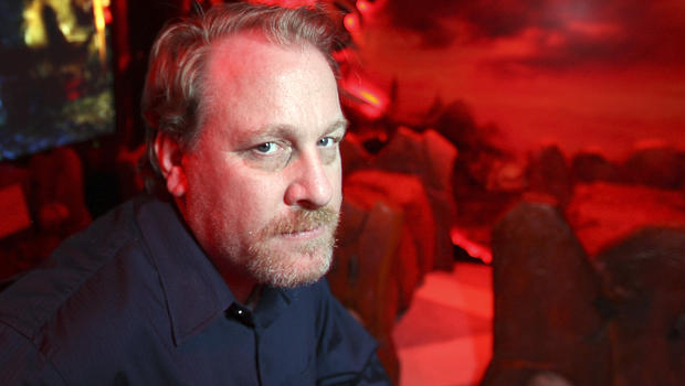 Former MLB player Curt Schilling poses in a game demonstration room at the Electronic Entertainment Expo, or E3, June 9, 2011, in Los Angeles, California. 