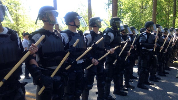 ​Police form a barrier between groups of protesters during a pro-white rally inside Georgia's Stone Mountain Park April 23, 2016. 