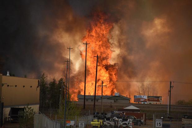 Flames rise in an industrial area south Fort McMurray, Alberta, Canada, on May 3, 2016. 