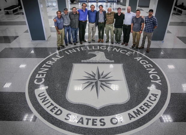 The Spymasters crew poses at CIA headquarters 