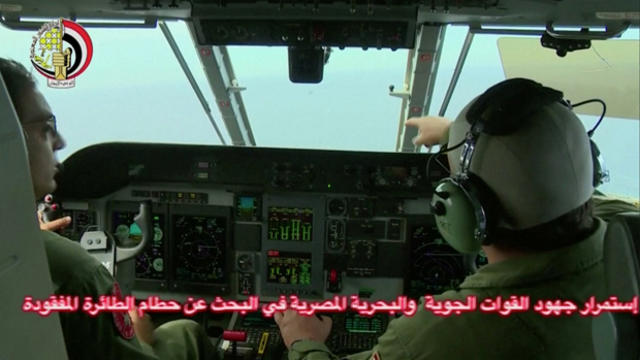 ​An Egyptian pilot points during a search operation by Egyptian air and navy forces for the EgyptAir plane that disappeared in the Mediterranean Sea in this still image taken from video May 20, 2016. 