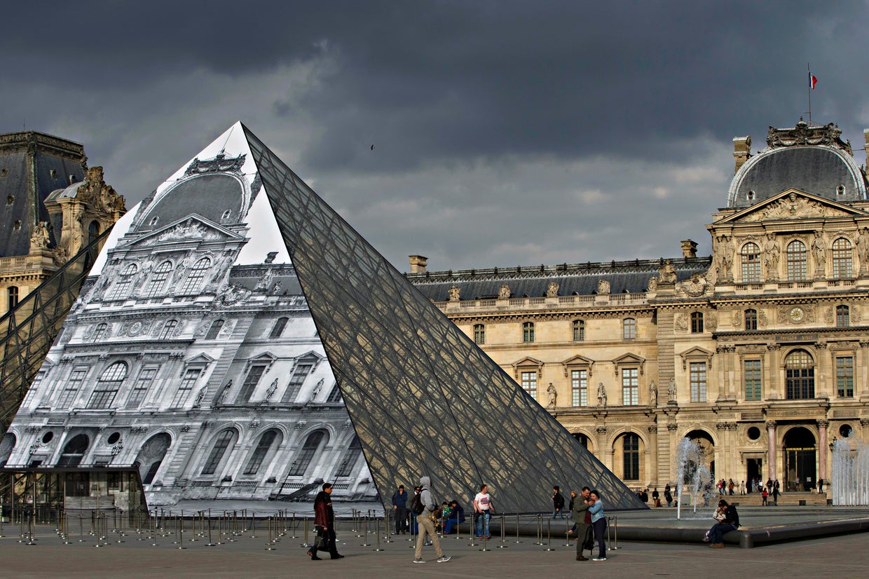 French street artist JR makes the Louvre Pyramid disappear