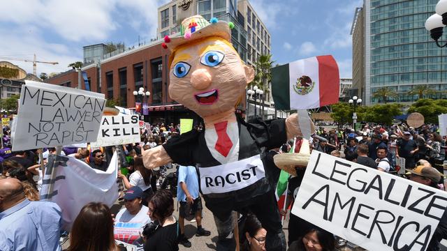 Anti-Donald Trump protesters demonstrate outside a venue where the Republican presidential candidate was expected to speak in San Diego, California, on May 27, 2016. 