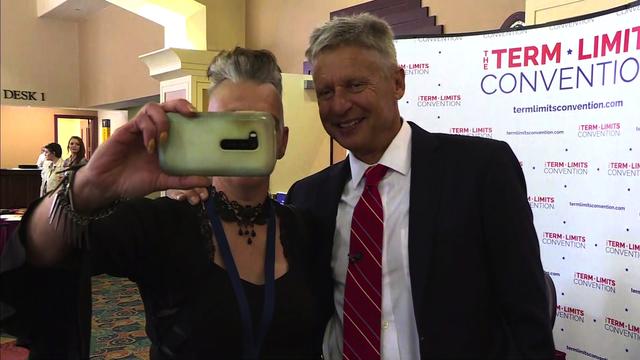 Libertarian presidential candidate and former New Mexico Gov. Gary Johnson poses for a photo with a supporter at the Libertarian National Convention in Orlando, Florida, on May 27, 2016. 