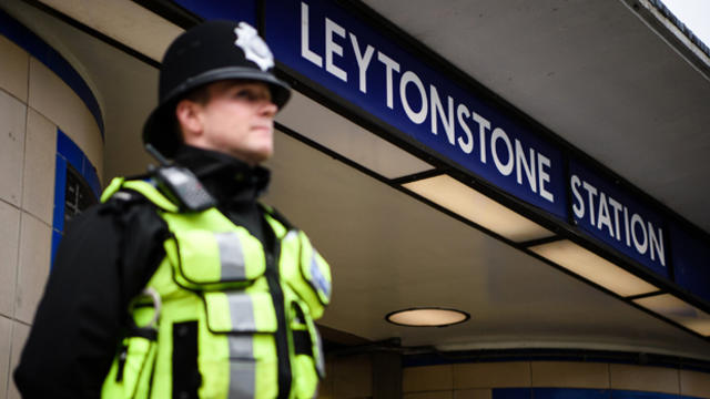 A police officer stands guard outside Leytonstone station in north London on Dec. 6, 2015, a day after three people were stabbed in what police treated as a "terrorist incident." 