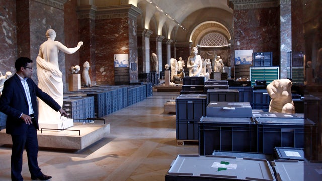 Artworks in plastic boxes placed between sculptures are packed to be moved from Louvre storeroom to exhibition halls on June 03, 2016 to protect them from rising floodwaters from River Seine 