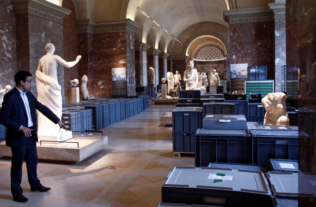 Artworks in plastic boxes placed between sculptures are packed to be moved from Louvre storeroom to exhibition halls on June 03, 2016 to protect them from rising floodwaters from River Seine 