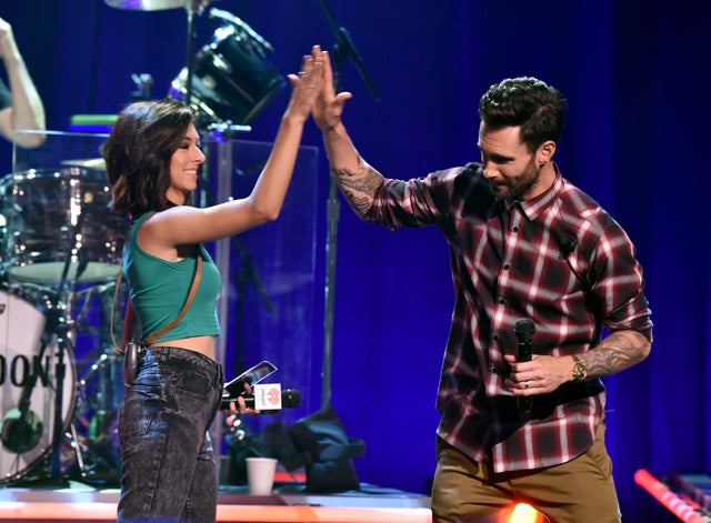 Singers Christina Grimmie and Adam Levine speak onstage during the iHeartRadio Album Release Party with Maroon 5 on the CW at iHeartRadio Theater on Aug. 26, 2014, in Burbank, California. 