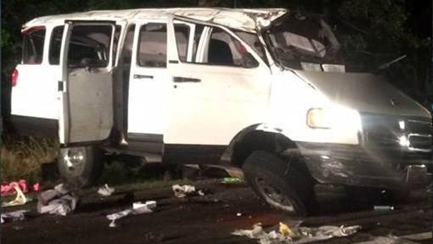 ​A van hit a car on Interstate 95 in Virginia and overturned early June 18, 2016. 
