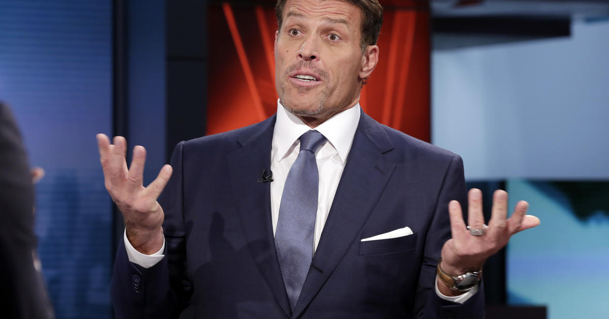 Tony Robbins supporters defend motivational guru's hot coal walk - CBS News