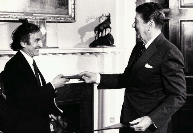 Holocaust survivor Elie Wiesel, who was a child prisoner in World War II concentration camps, receives the Congressional Gold Medal from President Ronald Reagan at the White House April 14, 1985, in Washington, D.C. 