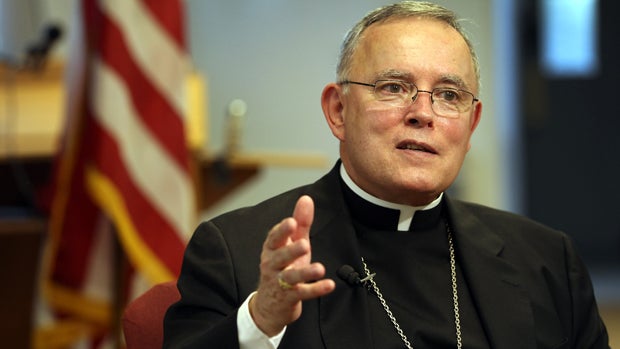 Then-Catholic Archbishop of Denver Charles Chaput answers questions at a news conference on July 20, 2011, in Denver, Colorado. 
