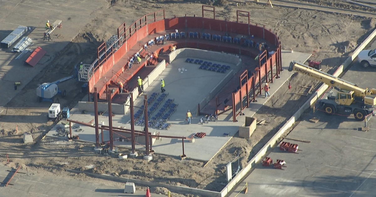 Last large section of the Mile High stadium during demolition : r