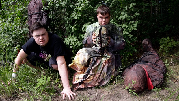 Sam Suchmann, left, and Mattie Zufelt pose with ghoulish figures at Sam's home in Providence, Rhode Island, on July 12, 2016. Suchmann and Zufelt, best friends with Down syndrome, are living their dreams of making a full-length, epic zombie movie and beco 