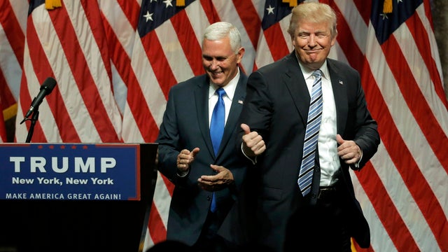Republican presidential candidate Donald Trump points to Indiana Gov. Mike Pence after introducing Pence as his vice presidential running mate in New York City July 16, 2016. 