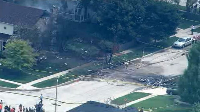 ​An aerial view shows the aftermath of a small plane crash in Plainfield, Illinois, on July 21, 2016. 