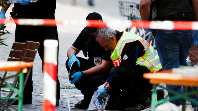 Police secure the area after an explosion in Ansbach, Germany, July 25, 2016. 