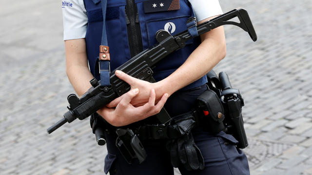 ​A police officer stands guard outside the Sainte-Gudule cathedral as Belgium's King Philippe and Queen Mathilde attend a religious service on the country's national holiday in Brussels, July 21, 2016. 