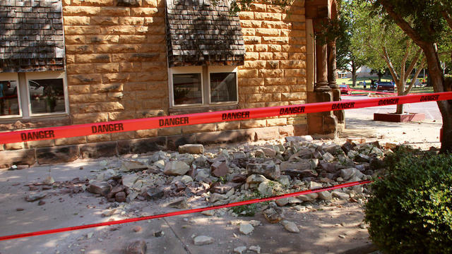 Stonework litters the sidewalk outside an empty jewelry store at the corner of Sixth and Harrison in Pawnee, Oklahoma, Sept. 3, 2016, after a 5.6 earthquake struck near the north-central Oklahoma town. 