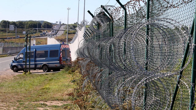 A riot gendarmerie van secures the entrance of the Channel Tunnel in Coquelles, France, Sept. 7, 2016. 