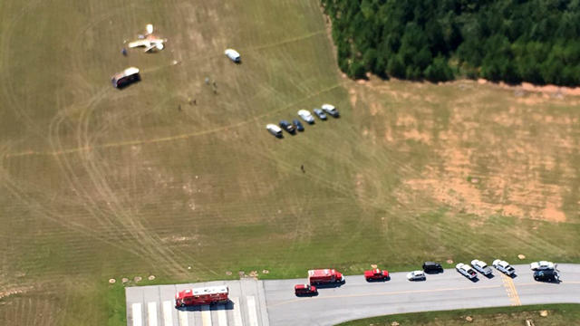 Crews work the scene after two planes collided over Carroll County, Georgia, on Sept. 7, 2016. 