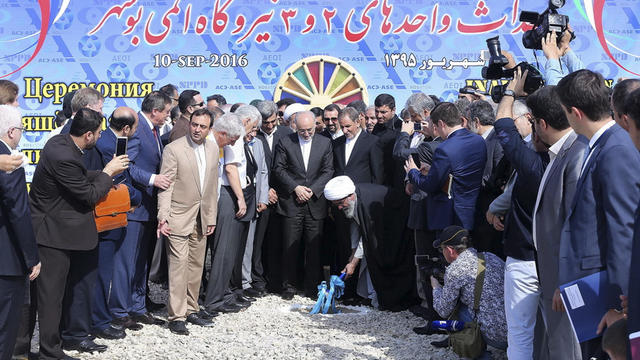 Ayatollah Gholam Ali Safaei Bushehri, center bottom, Iranian Supreme Leader Ali Khamenei’s representative in Bushehr province, breaks ground in a ceremony to begin building Iran’s second nuclear power plant in the southern port city of Bushehr, Iran, in t 