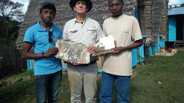 American wreckage hunter Blaine Gibson shows off pieces of suspected aircraft debris that he believes could be from missing Malaysia Airlines Flight 370 