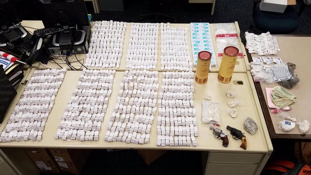 About 50,000 bags of heroin, three-quarters of a pound of raw heroin and two handguns are seen among the items seized by police in Hartford, Connecticut, in a drug bust on Sept. 13, 2016. 