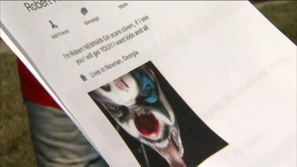 A printout of a Facebook profile page shows a threat by a user claiming to be &ldquo;The Newnan Clown.&rdquo; 