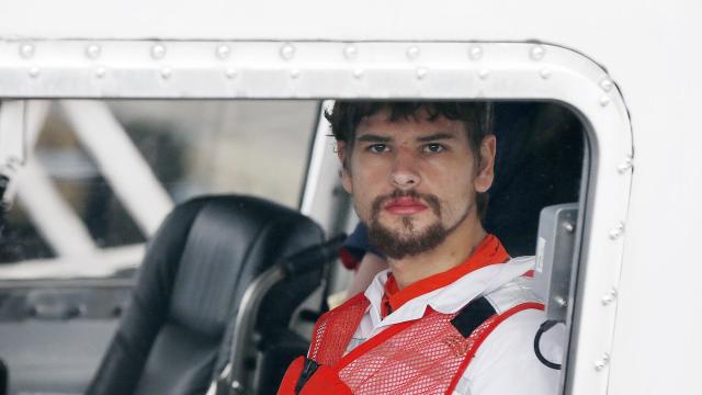 Nathan Carman arrives in a small boat at the U.S. Coast Guard station in Boston Sept. 27, 2016. Carman spent a week at sea in a life raft before being rescued by a passing freighter. 