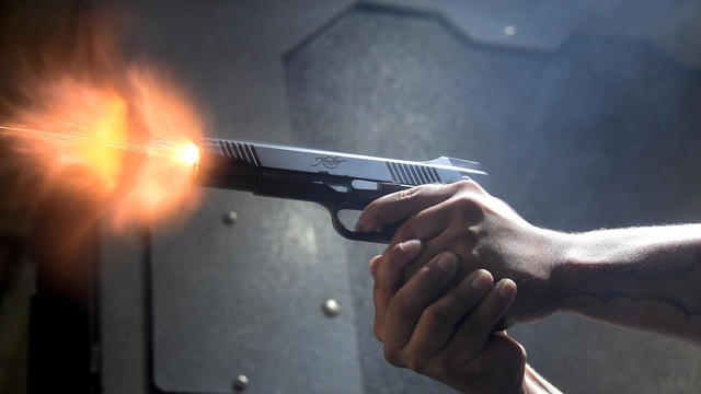 A gun enthusiast fires his Kimber 1911 pistol at the LAX Firing Range in Inglewood, California, on Sept. 7, 2016. 