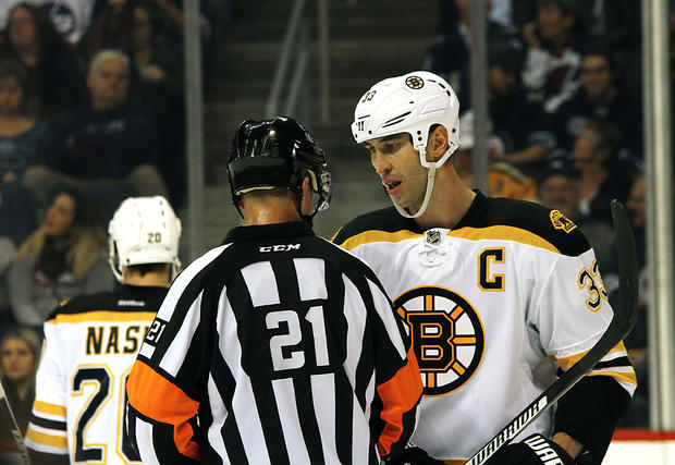 Zdeno Chara with referee - Boston Bruins v Winnipeg Jets 