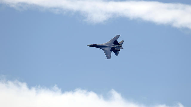 A Russian Sukhoi SU-35 jet flies over Le Bourget airport near Paris on June 23, 2013, the last day of the 50th International Paris Air Show. 