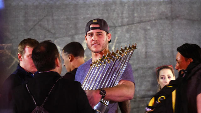 Chicago Cubs first baseman Anthony Rizzo displays the Commissioner’s Trophy as the team arrives at Wrigley Field in Chicago early Nov. 3, 2016, after the Cubs defeated the Cleveland Indians 8-7 in Game 7 of the World Series in Cleveland. 