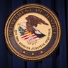 The Department of Justice logo is pictured on a wall after a news conference in New York Dec. 5, 2013. 