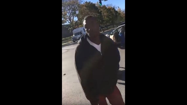 An unidentified man looks into a cellphone camera after punching a motorist multiple times in a Chicago intersection in this image capture from a video posted to YouTube on Nov. 9, 2016. 