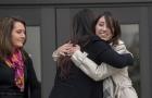 Michelle Susan Hadley, right, hugs Orange County District Attorney Chief of Staff Susan Kang Schroeder after being cleared of all charges in a complicated plot to frame her in Fullerton, Calif., Jan. 9, 2017. Her mother, Suzanne Hadley, is at left. 